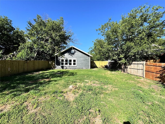 view of yard with a fenced backyard