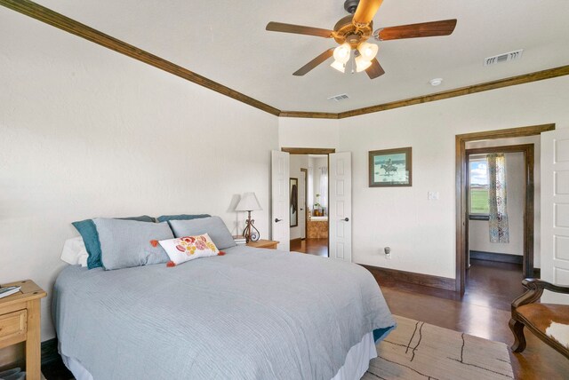 bedroom with crown molding, dark wood-type flooring, and ceiling fan