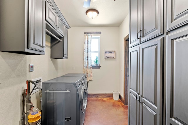 laundry area featuring separate washer and dryer, cabinets, and washer hookup