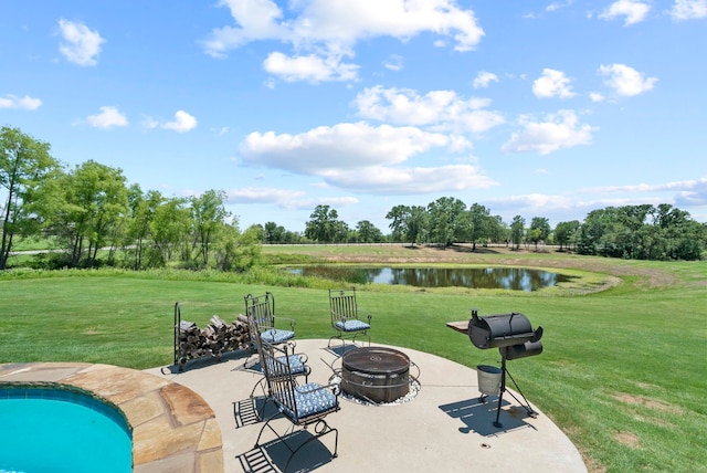 view of patio / terrace with a water view and a fire pit