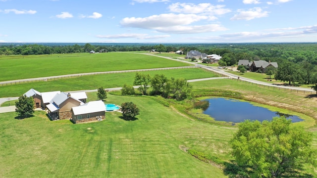 aerial view with a rural view and a water view