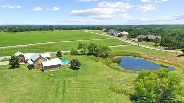 view of swimming pool with a lawn