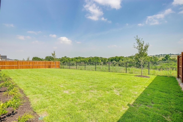 view of yard with fence