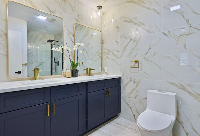 bathroom with vanity, toilet, a shower with shower door, and tile walls