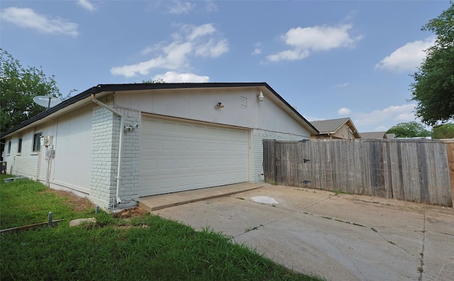 view of side of home with a garage