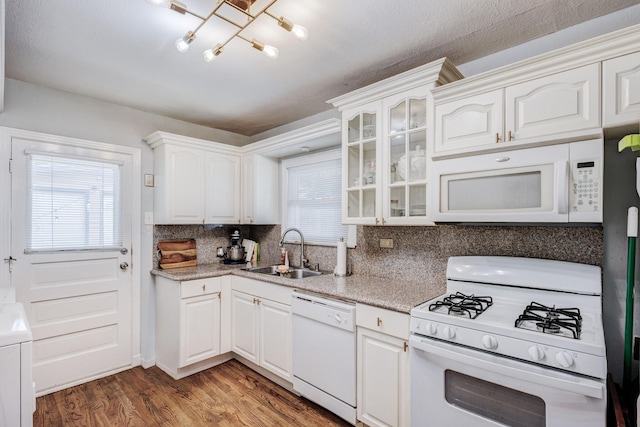 kitchen with dark hardwood / wood-style floors, white cabinetry, white appliances, and sink