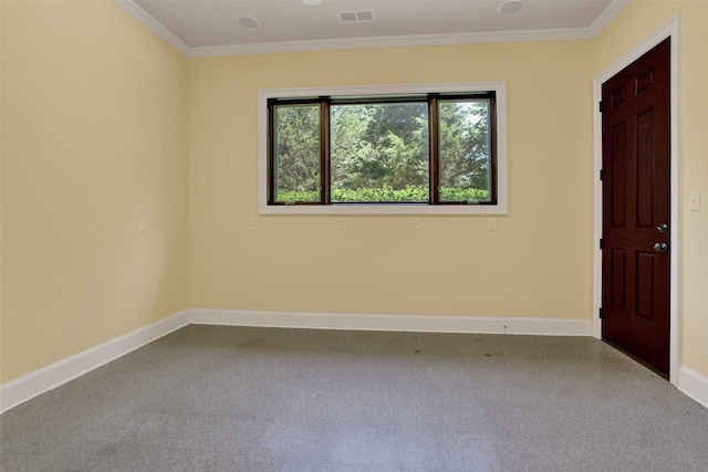 empty room with carpet, visible vents, baseboards, and ornamental molding