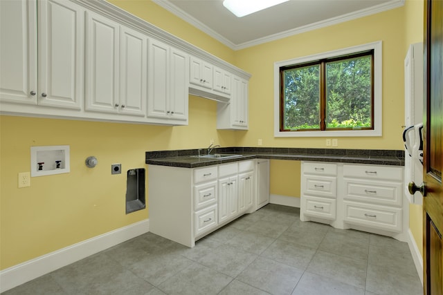 washroom featuring sink, crown molding, hookup for an electric dryer, and light tile floors