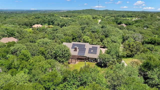 bird's eye view featuring a view of trees