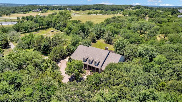 aerial view featuring a wooded view