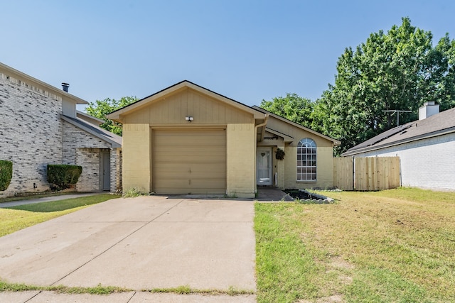 ranch-style home with a garage and a front yard