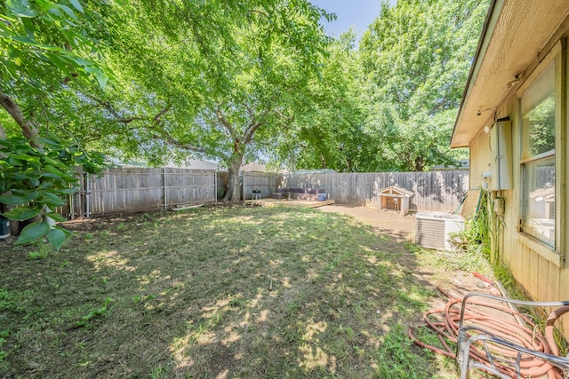 view of yard with central AC