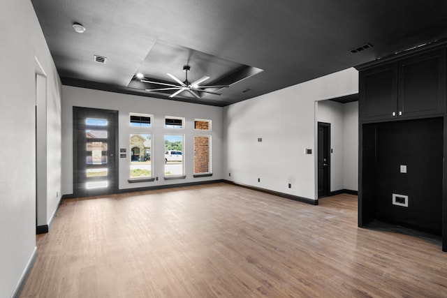 empty room featuring ceiling fan and light hardwood / wood-style flooring