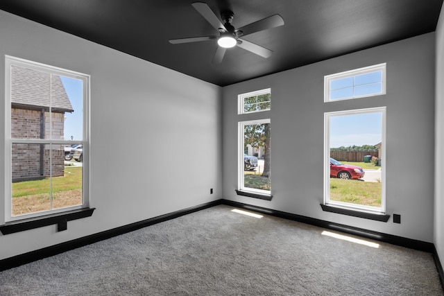 carpeted empty room with ceiling fan