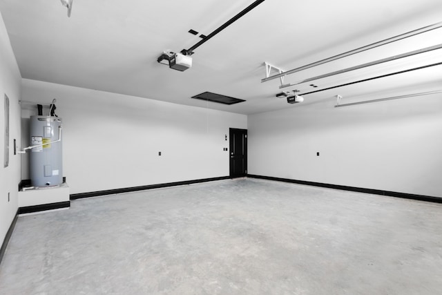 garage featuring water heater and a garage door opener