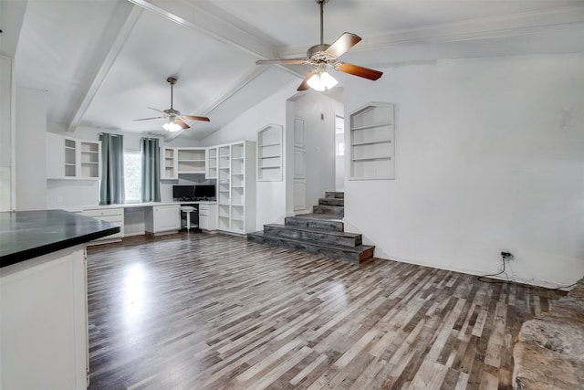 unfurnished living room featuring wood-type flooring, lofted ceiling with beams, and ceiling fan