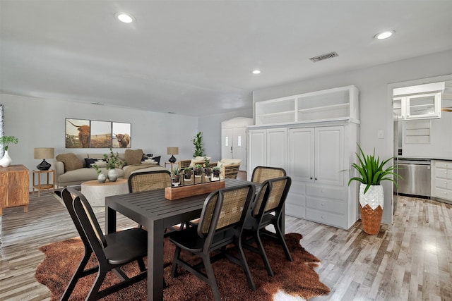 dining space featuring light wood-type flooring