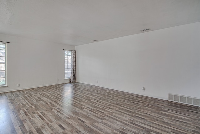 empty room with hardwood / wood-style flooring