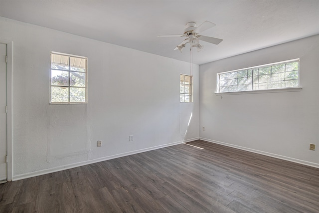 spare room featuring ceiling fan and dark hardwood / wood-style floors