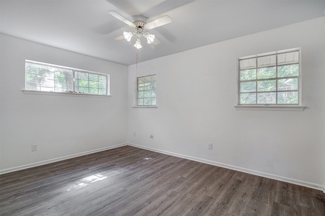 unfurnished room featuring dark hardwood / wood-style floors and ceiling fan