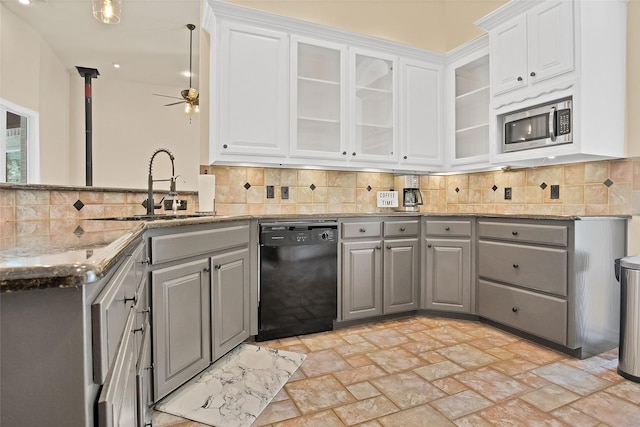 kitchen with stainless steel microwave, black dishwasher, tasteful backsplash, gray cabinets, and white cabinets