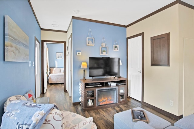 living room featuring dark hardwood / wood-style flooring and ornamental molding