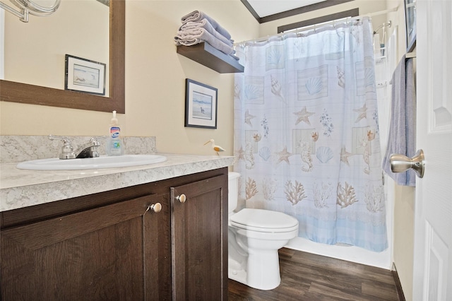 full bathroom with shower / bath combination with curtain, vanity, crown molding, hardwood / wood-style flooring, and toilet