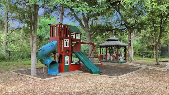 view of playground with a gazebo and a trampoline