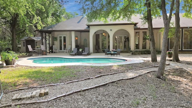 view of pool featuring french doors and a patio