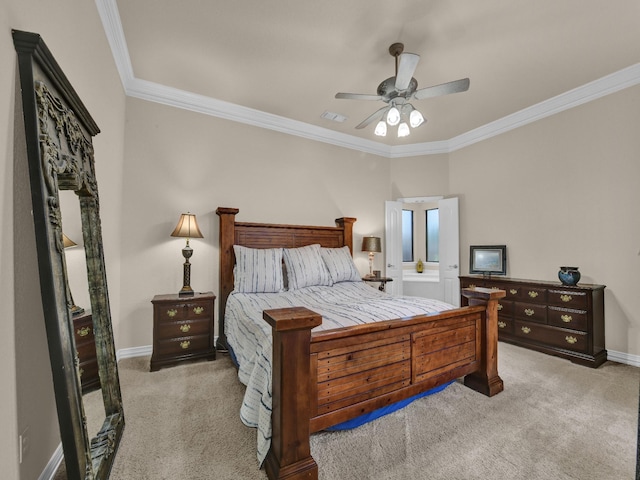 carpeted bedroom featuring crown molding and ceiling fan