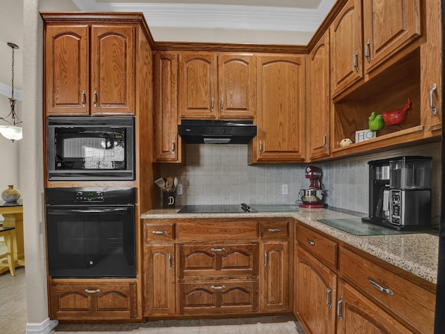 kitchen featuring pendant lighting, light tile patterned floors, light stone counters, tasteful backsplash, and black appliances