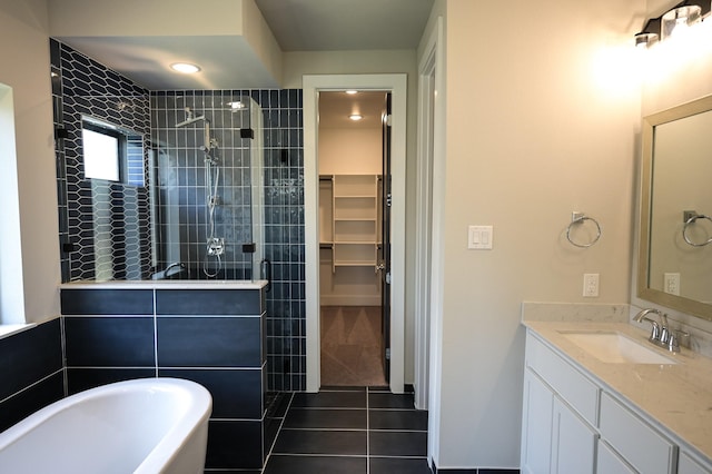 bathroom with vanity, tile patterned floors, and separate shower and tub