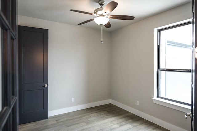 spare room featuring ceiling fan and light hardwood / wood-style floors