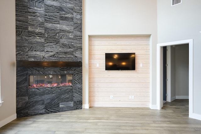 unfurnished living room with hardwood / wood-style flooring