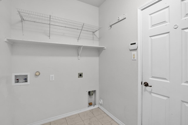 clothes washing area featuring light tile patterned floors, electric dryer hookup, washer hookup, and gas dryer hookup