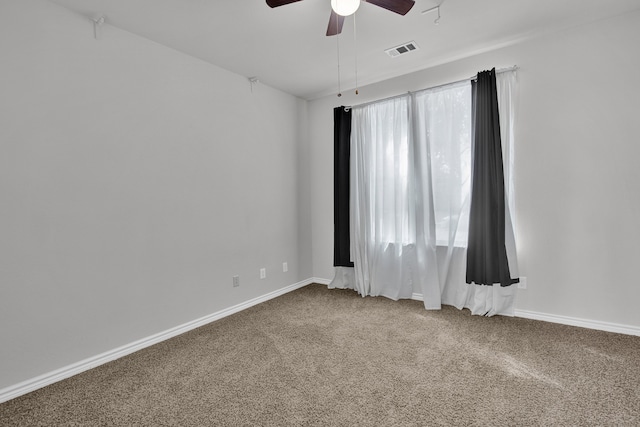 carpeted empty room with ceiling fan