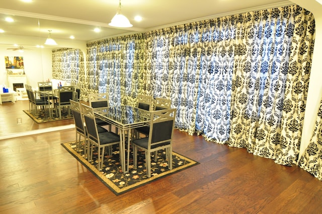 dining room with ceiling fan and hardwood / wood-style floors