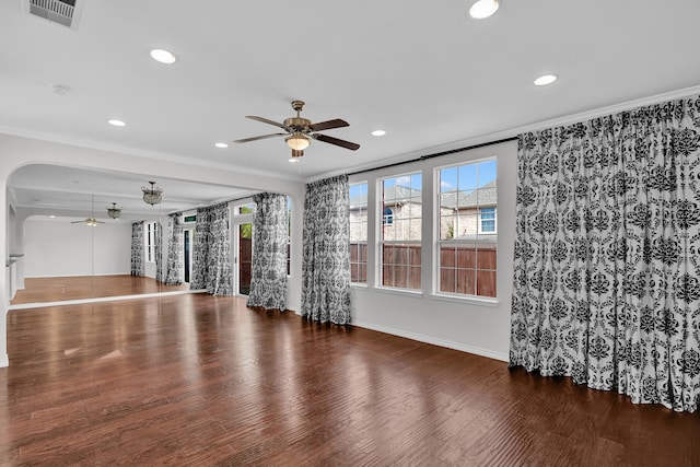 interior space with ceiling fan, ornamental molding, and hardwood / wood-style flooring