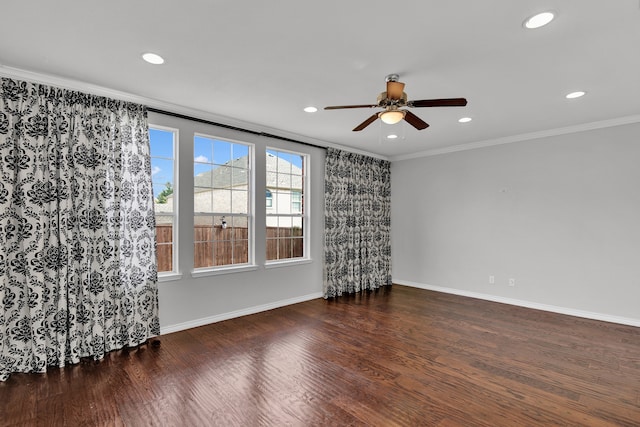 empty room featuring ceiling fan, hardwood / wood-style flooring, and crown molding