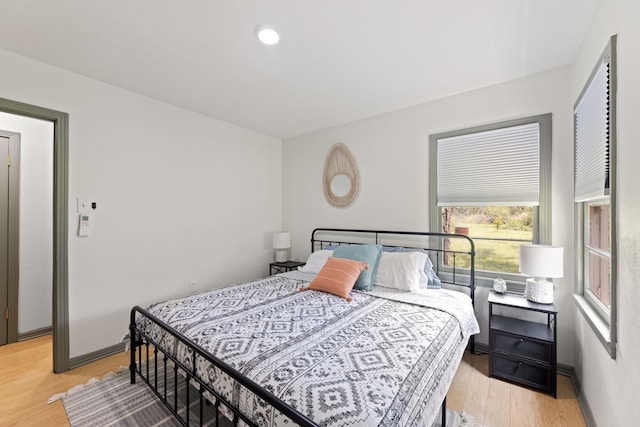 bedroom with light hardwood / wood-style floors