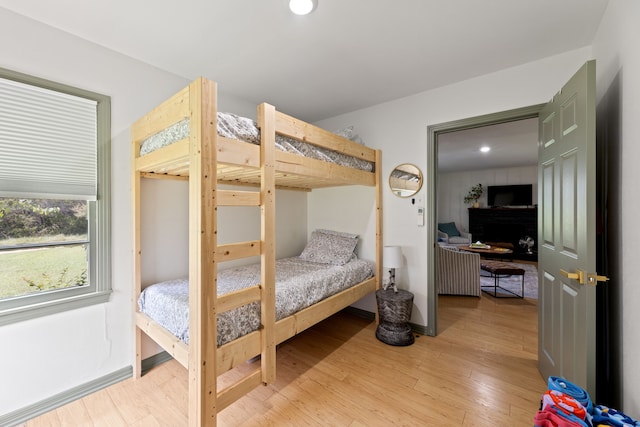 bedroom with light hardwood / wood-style floors