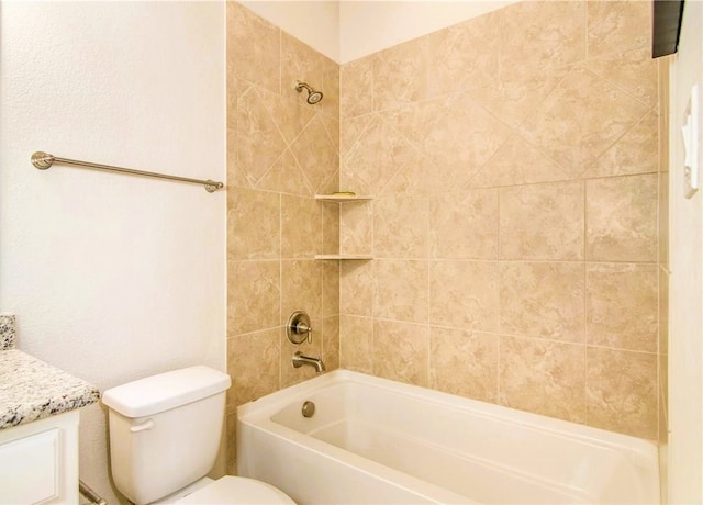 full bathroom featuring vanity, toilet, and tiled shower / bath