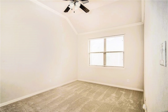 spare room featuring carpet flooring, ceiling fan, and vaulted ceiling