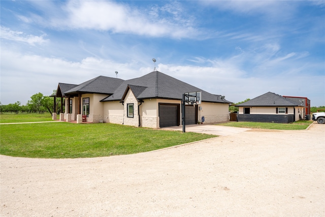 view of front of house with a garage and a front yard