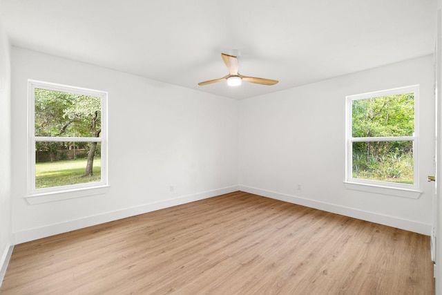 spare room featuring ceiling fan and light hardwood / wood-style flooring