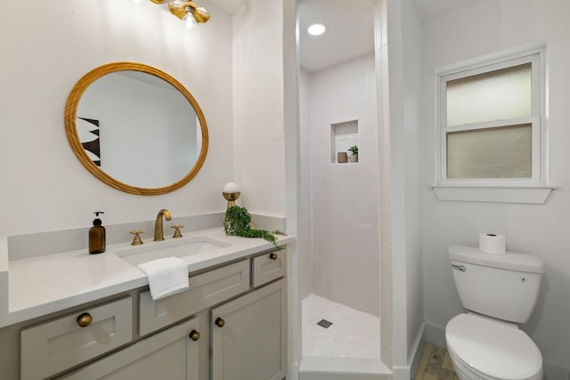 bathroom featuring walk in shower, vanity, and toilet