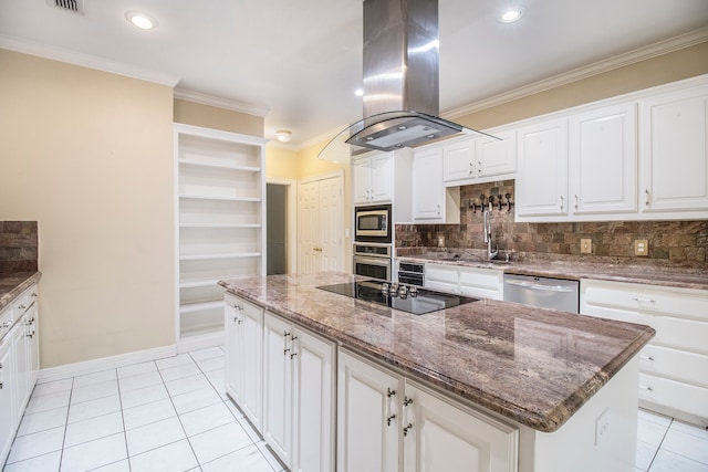 kitchen with island range hood, white cabinetry, ornamental molding, and light tile patterned flooring