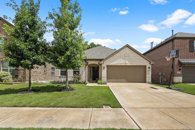 view of front of property featuring a garage and a front lawn