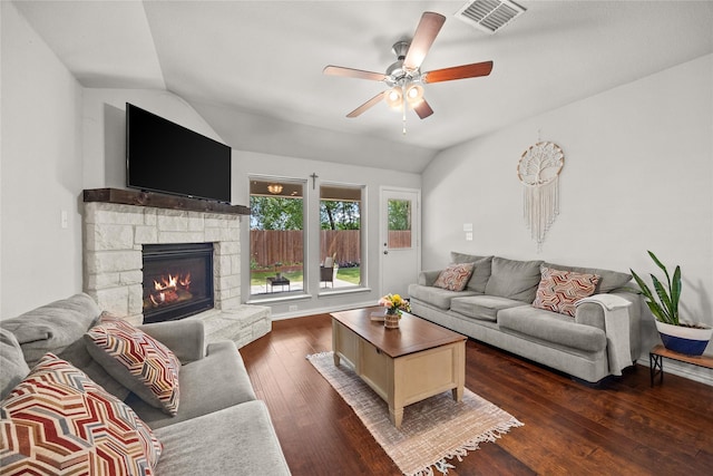 living room featuring ceiling fan, dark hardwood / wood-style floors, lofted ceiling, and a fireplace