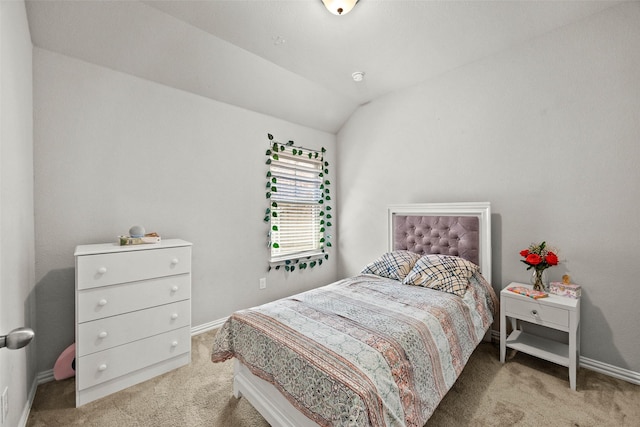 bedroom featuring carpet flooring and vaulted ceiling